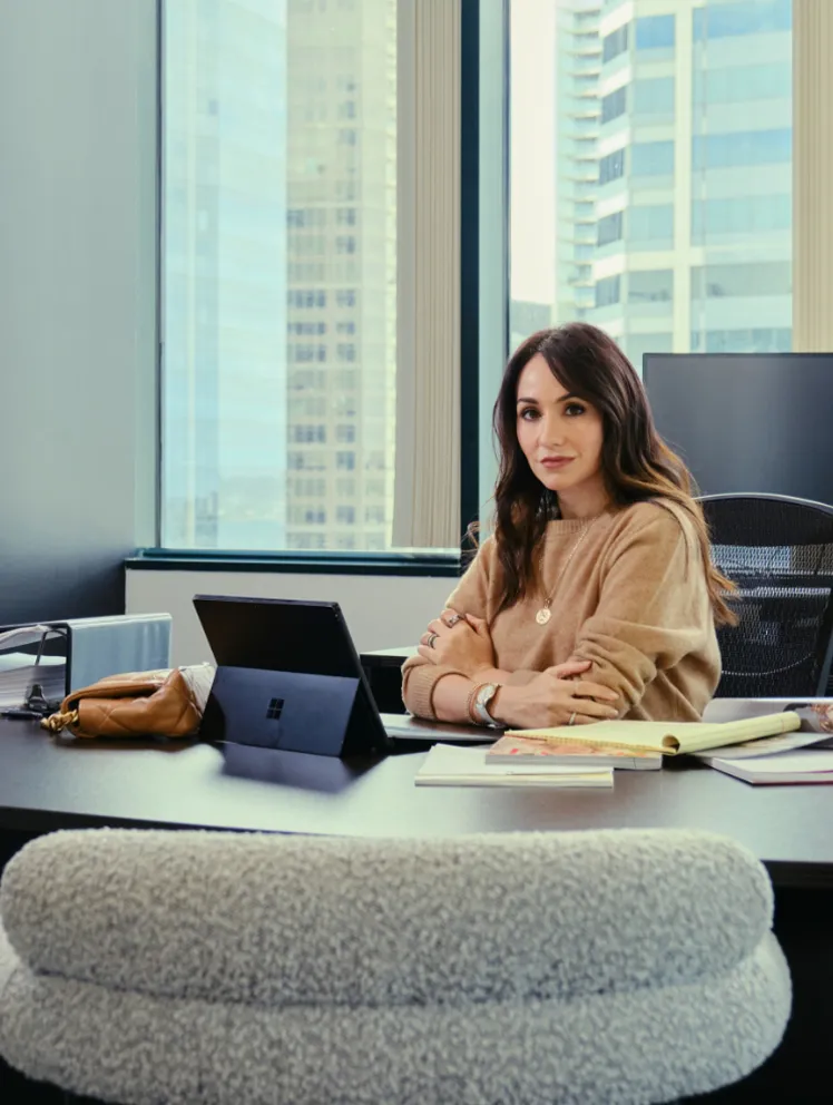 Dolores Contreras in front of office desk